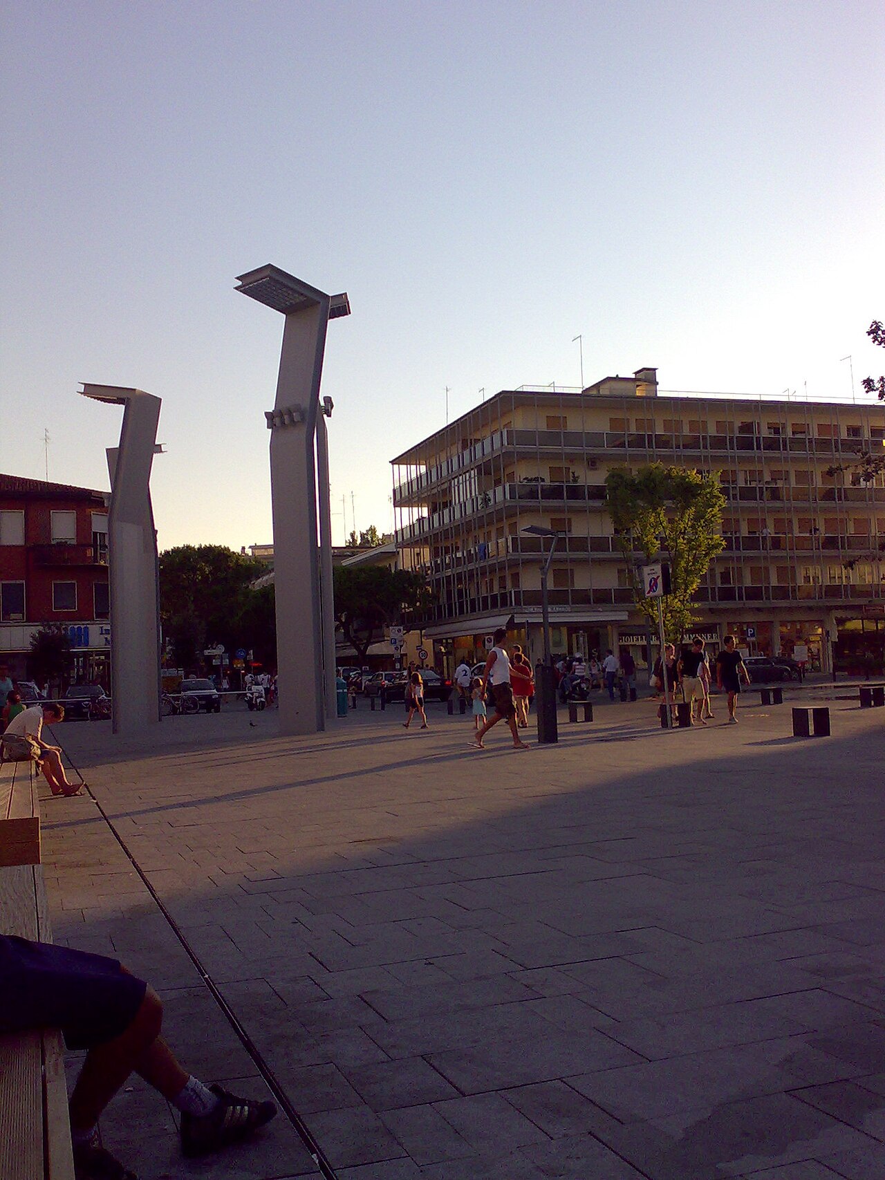 Piazza Mazzini in Jesolo Lido, the pedestrian heart of the resort, with residential blocks, bars and the pedestrian crossing of Via Bafile